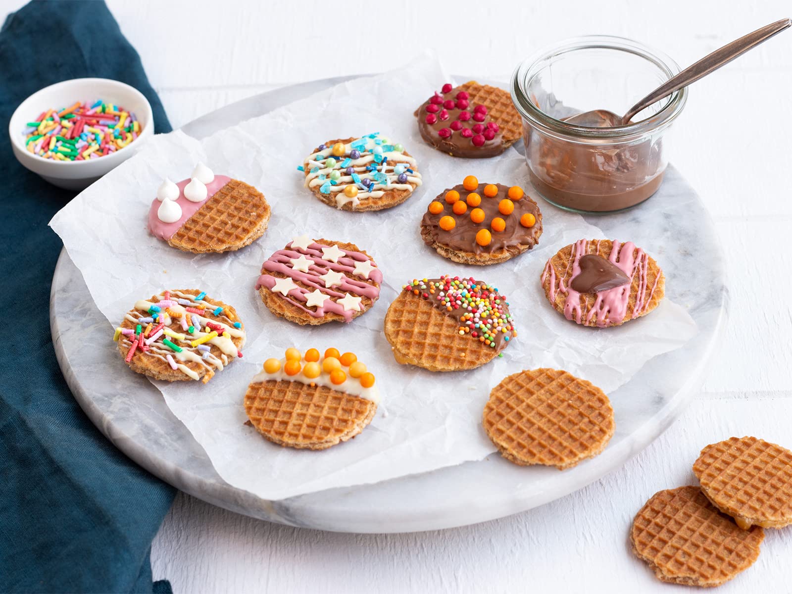 Daelmans serving platter with stroopwafels in cozy setting ideal for entertaining