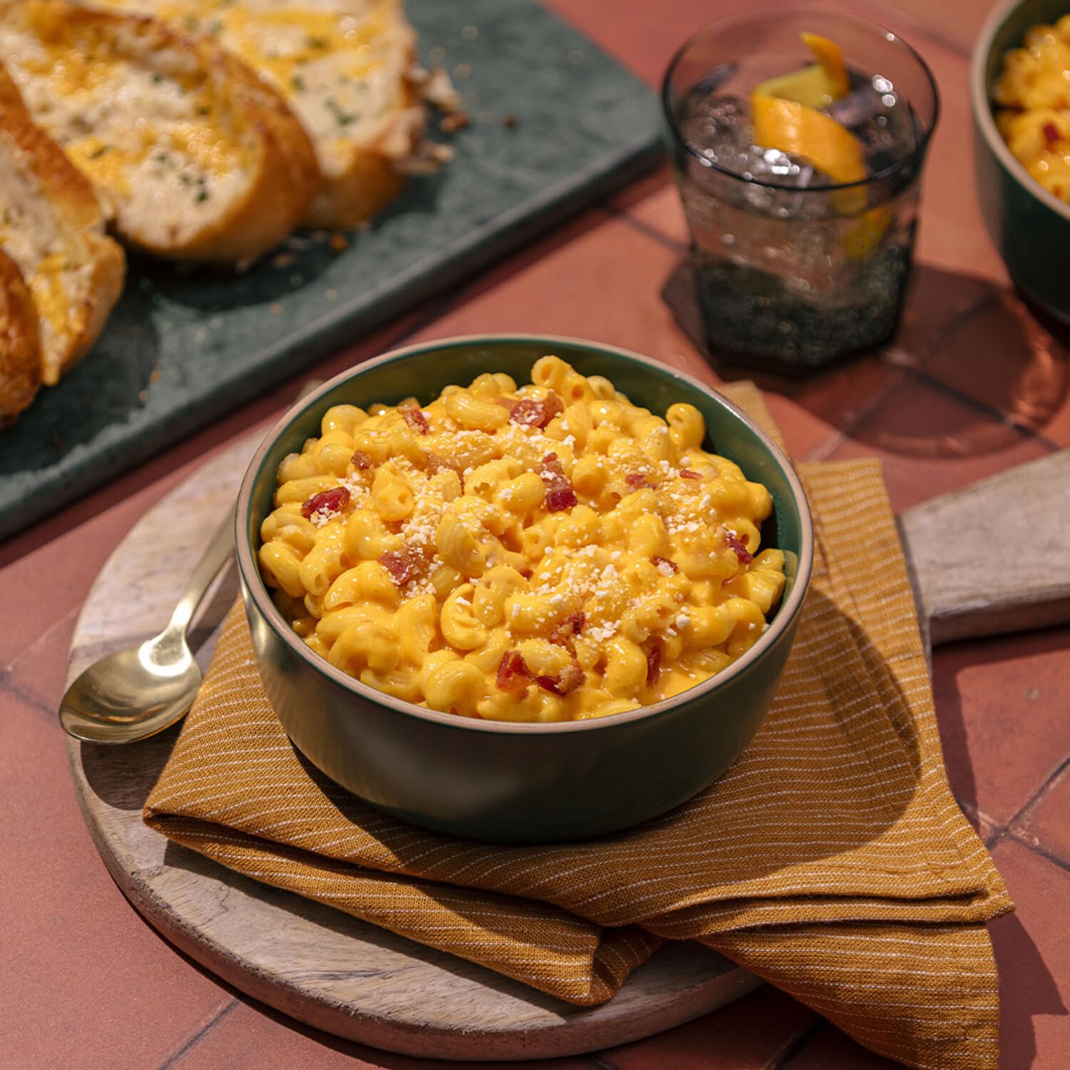 Daiya open cup revealing creamy plant-based cheddar-style sauce, looks rich