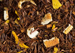 Dammann Frères sachet contents display rooibos leaves orange peel and sunflower petals visible benefits aroma