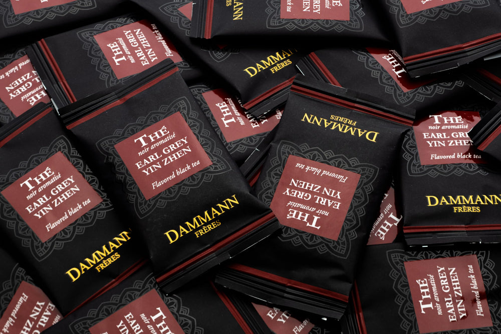 Dammann Freres box next to a ruler to show compact 24-count size and portability