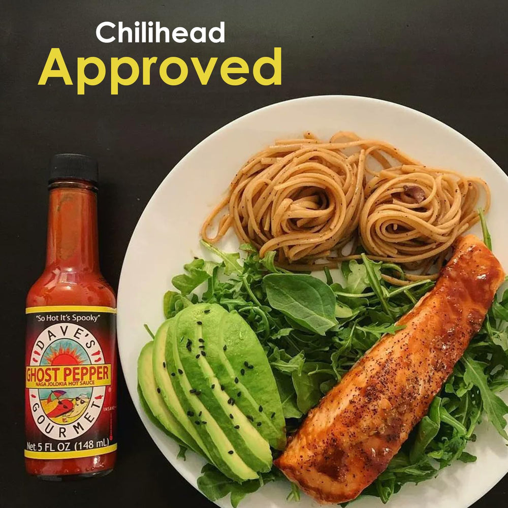 Dave's Gourmet drizzled over wings indicating spicy kick benefit for game-day dishes