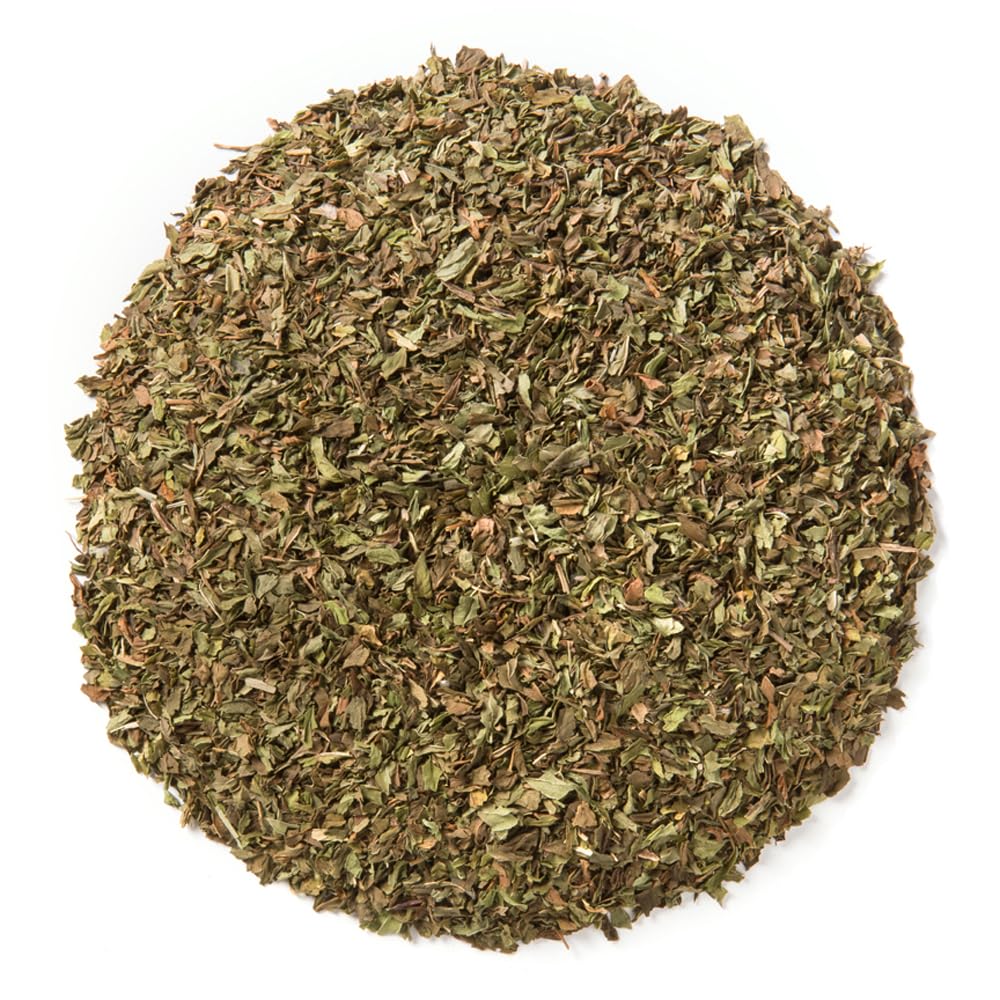Davidson's close-up of loose spearmint leaves displaying texture and aromatic oils