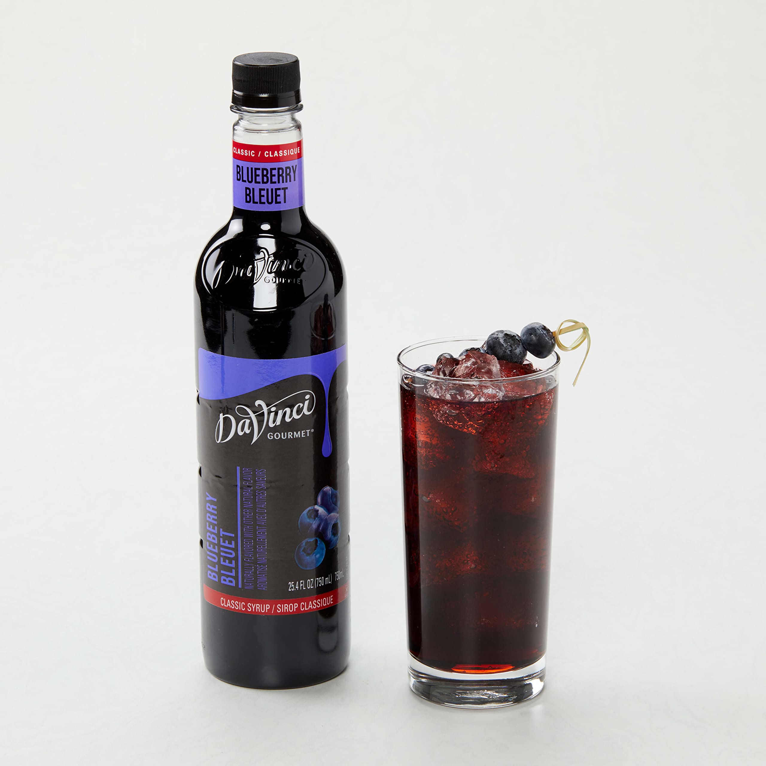DaVinci Gourmet bottle next to glass for scale and portioning guidance