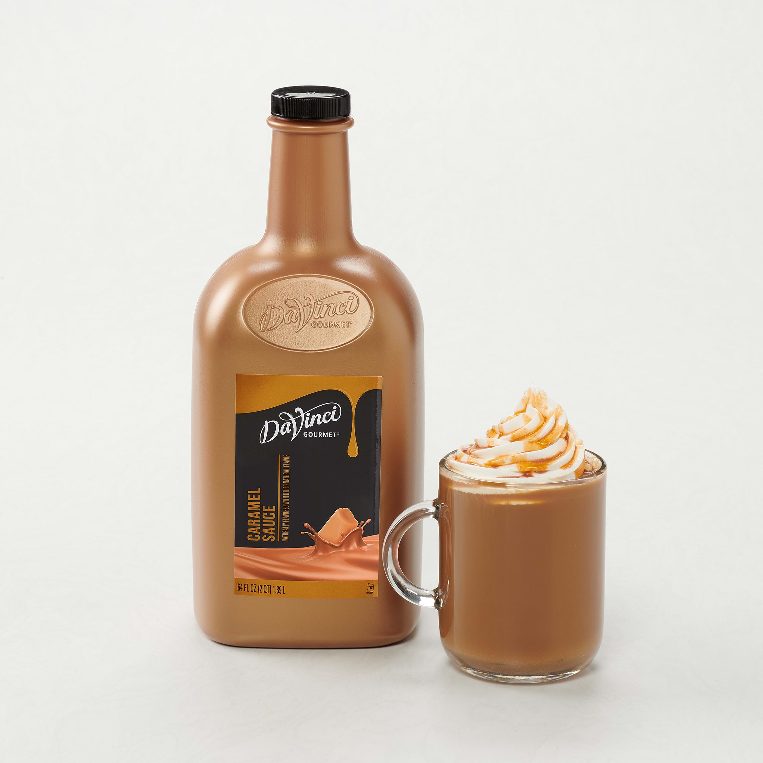 DaVinci Gourmet bottle held in hand to show large 64 fl oz supply advantage