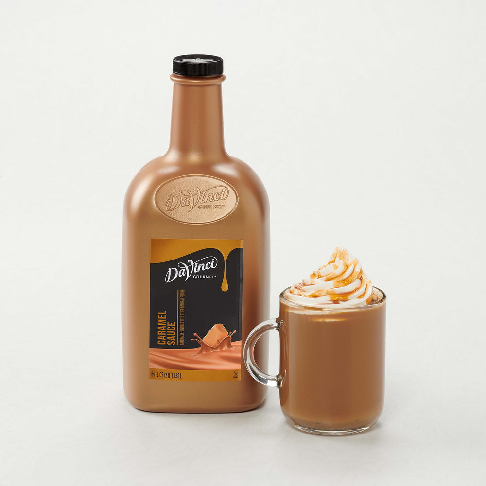 DaVinci Gourmet bottle held in hand to show large 64 fl oz supply advantage