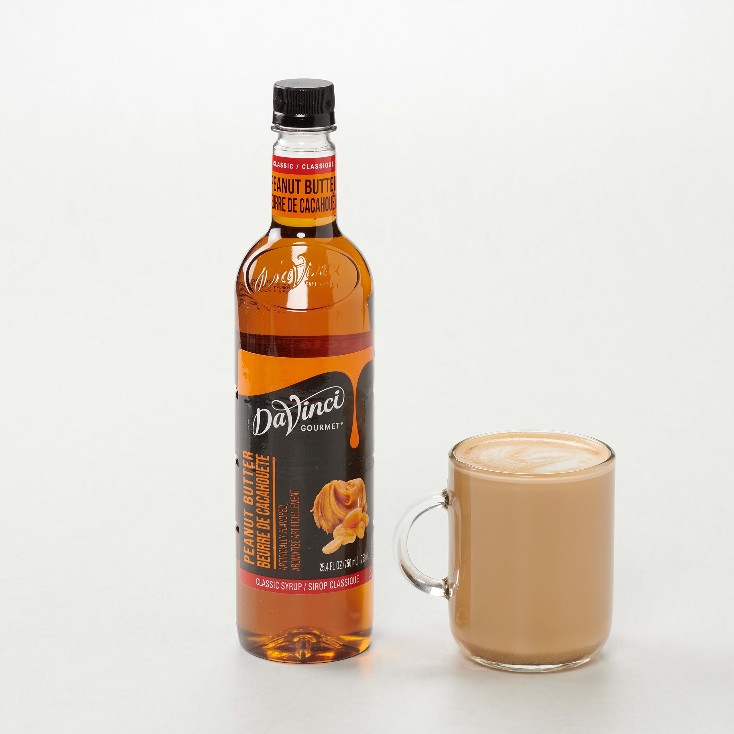 25.4 fl oz DaVinci Gourmet bottle next to a hand to show size and yield advantage
