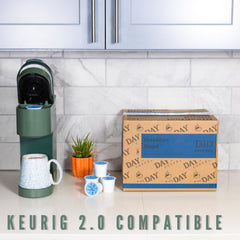 Day To Day Coffee pod inside single-serve brewer showing fast brewing convenience benefit