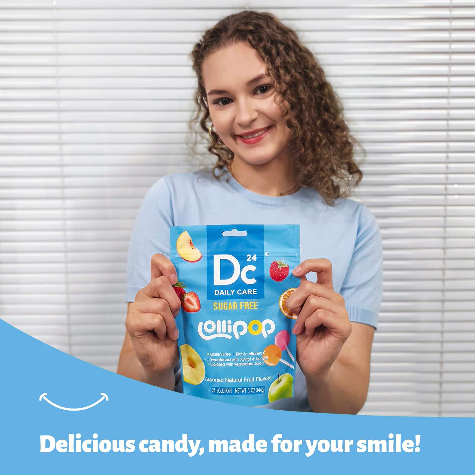 DC24 DAILY CARE lollipop held in hand showing real size and scale