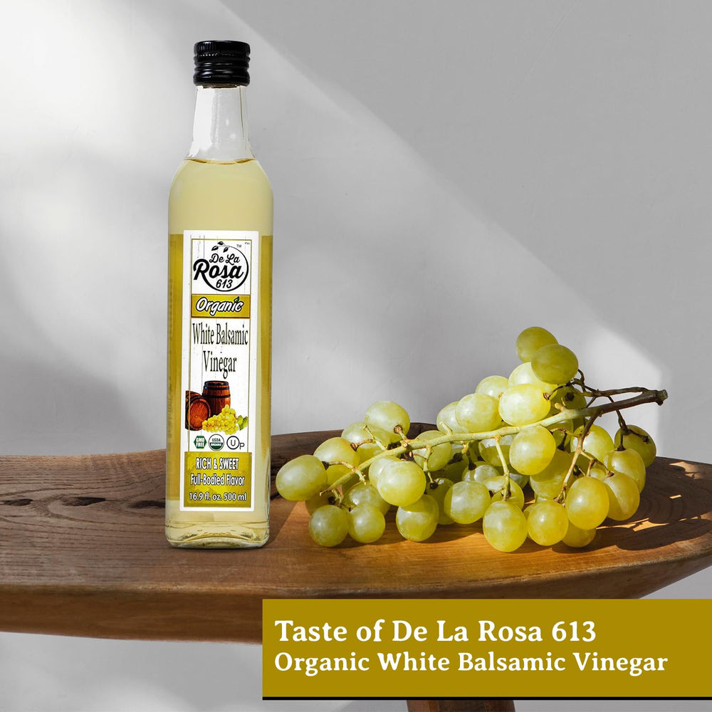de la rosa 613 bottle next to fruit for clear size and scale reference