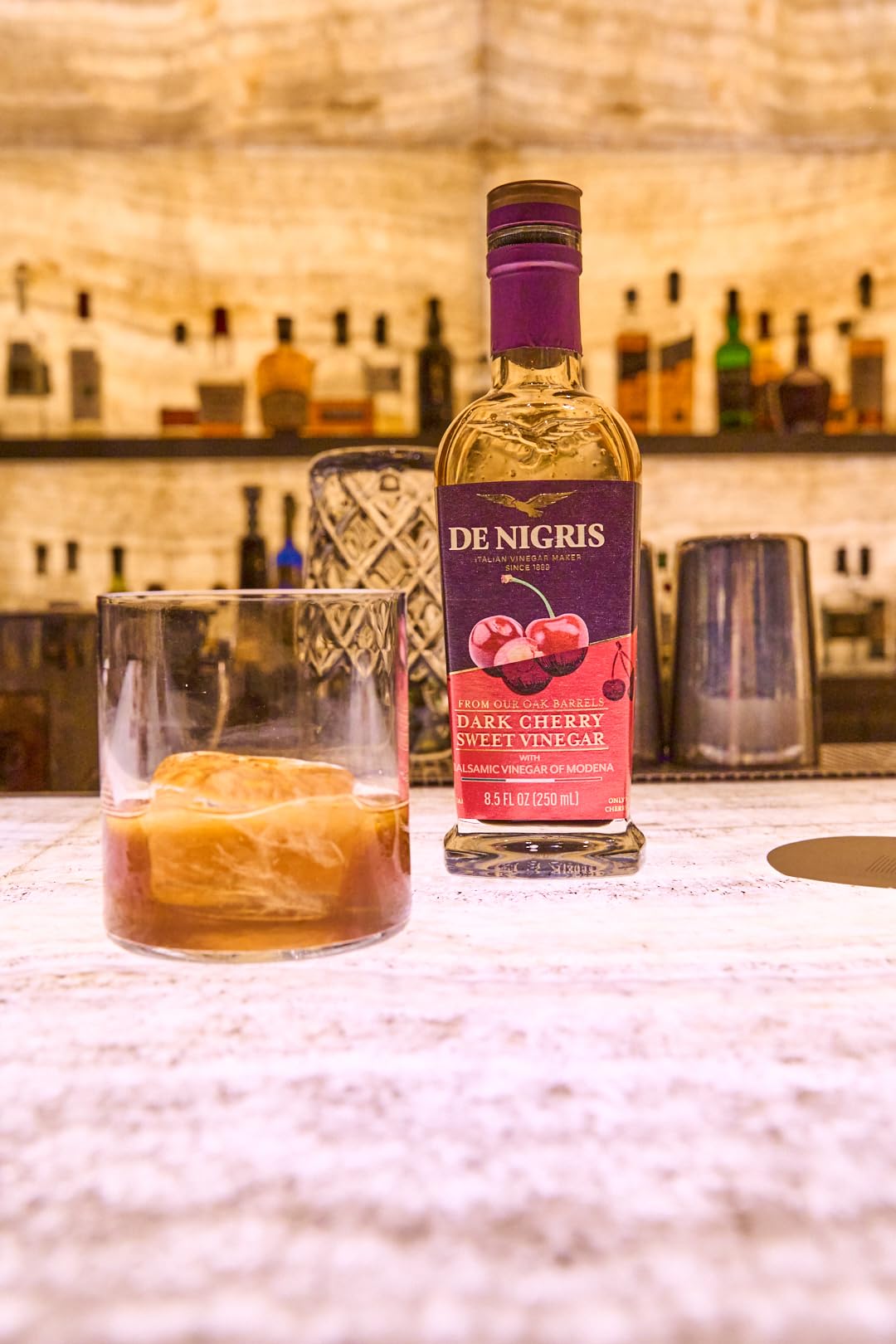 de nigris pouring over salad showing drizzle adds sweet-tart flavor benefit