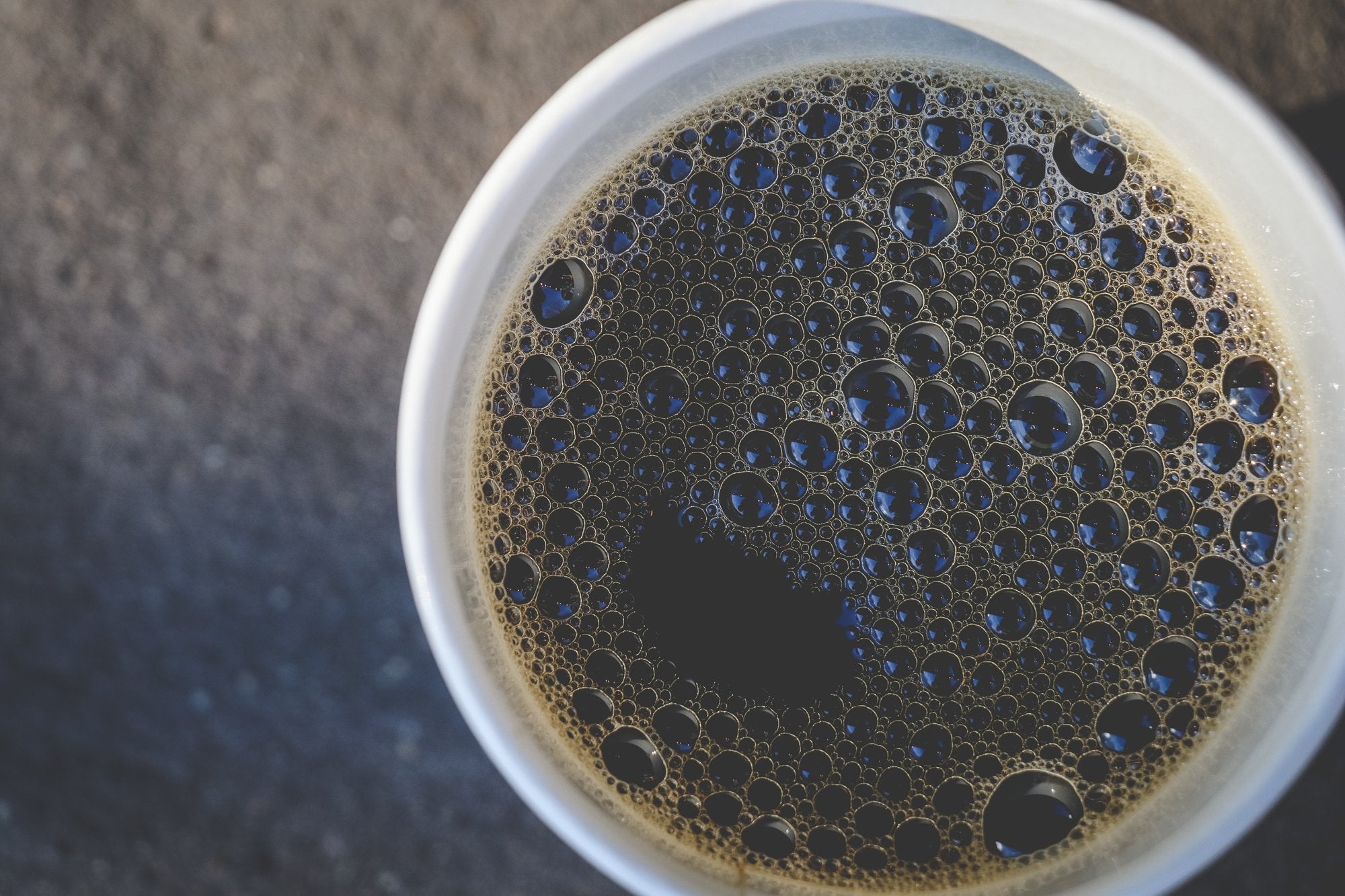 Death Wish Coffee brewed cup in lifestyle scene demonstrating bold flavor enjoyment