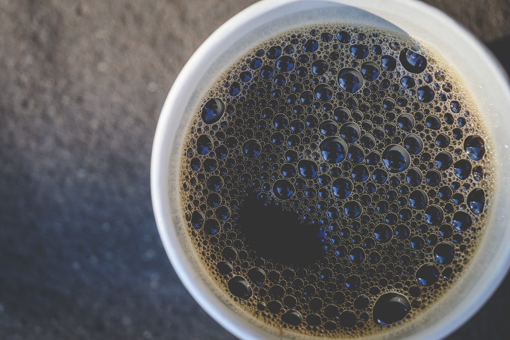 Death Wish Coffee brewed cup in lifestyle scene demonstrating bold flavor enjoyment