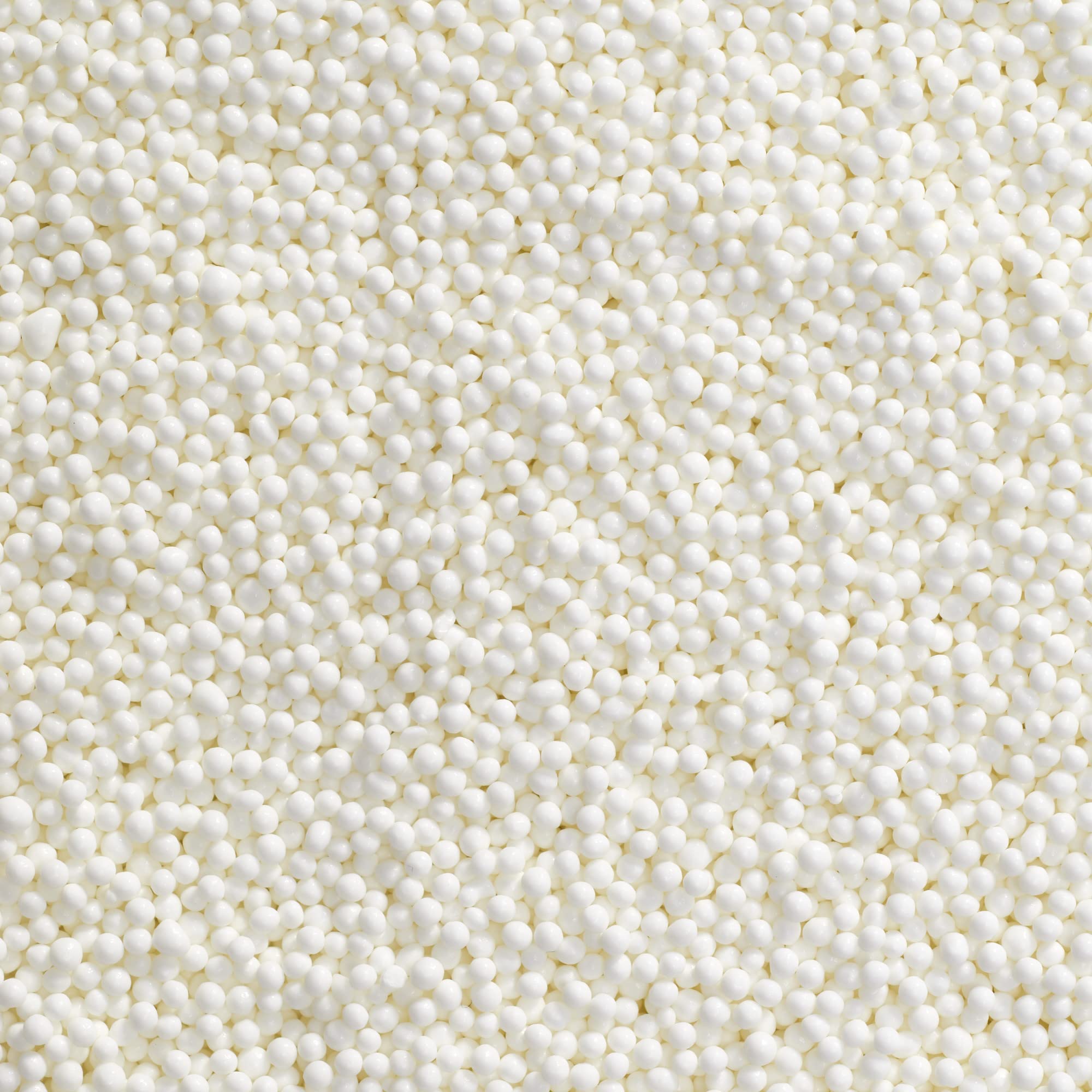 DecoPac close-up of white nonpareils texture adding refined crunch