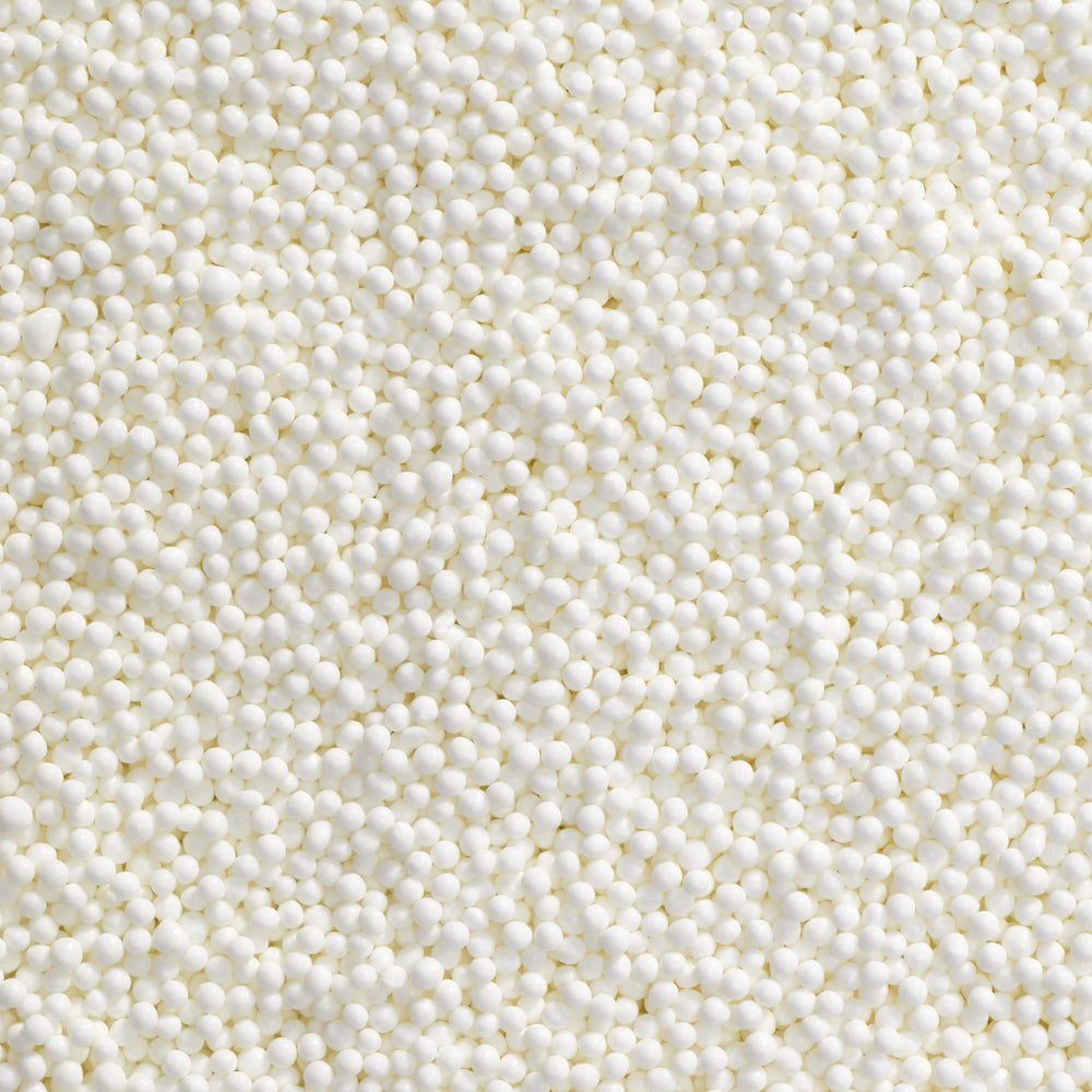 DecoPac close-up of white nonpareils texture adding refined crunch