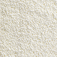 DecoPac close-up of white nonpareils texture adding refined crunch
