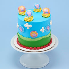 DecoPac Peppa Pig topper on cupcake in use enhancing party dessert appearance