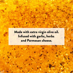 Shallow plate of DeLallo garlic parmesan oil beside crusty bread, perfect for dipping and entertaining
