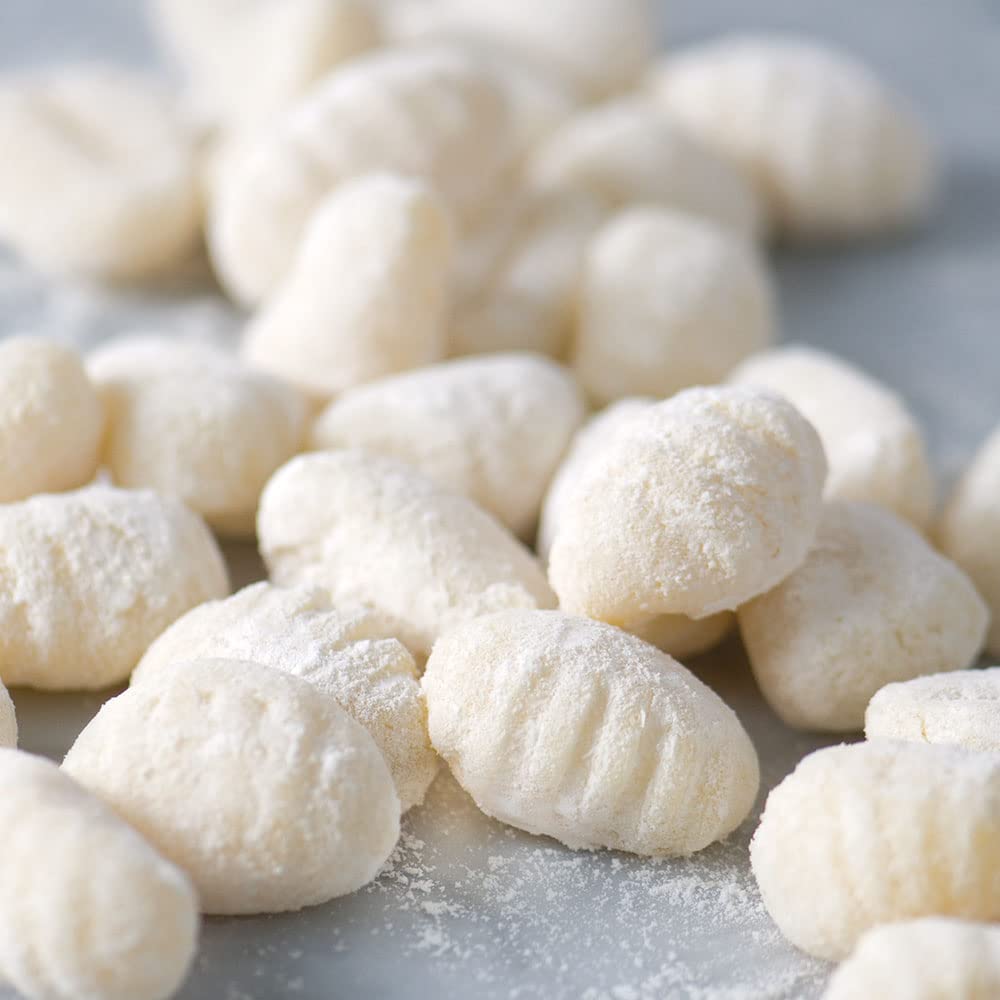 DeLallo cooked mini gnocchi in bowl with sauce showing quick meal