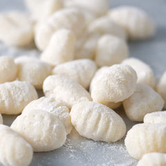 DeLallo cooked mini gnocchi in bowl with sauce showing quick meal