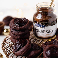 Measuring spoon with DeLallo instant espresso powder ready to boost recipes