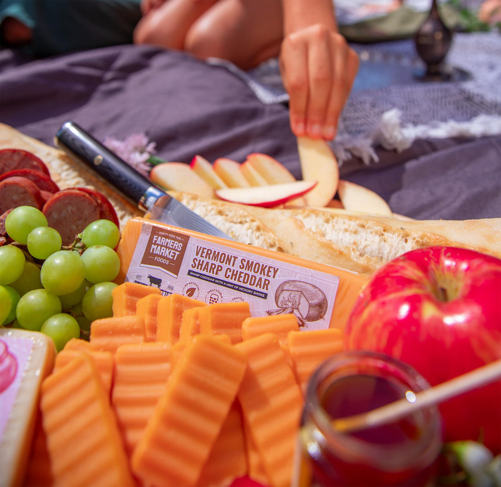 Deli Direct charcuterie board with cheeses paired with fruit and nuts for entertaining
