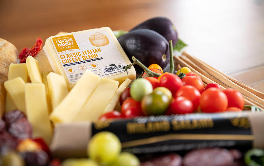 Deli Direct Classic Italian Blend grated over pasta adding savory melting convenience