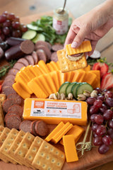 Deli Direct Alpine Baby Swiss sliced to show small eyes and melt-friendly texture