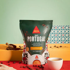 Delta Cafés brewed in a moka pot on a stove, highlighting easy flavorful home espresso