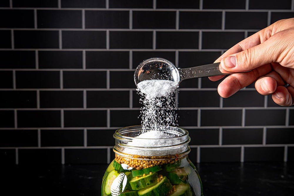 Diamond Crystal container in kitchen use beside cookware for quick-access seasoning benefit