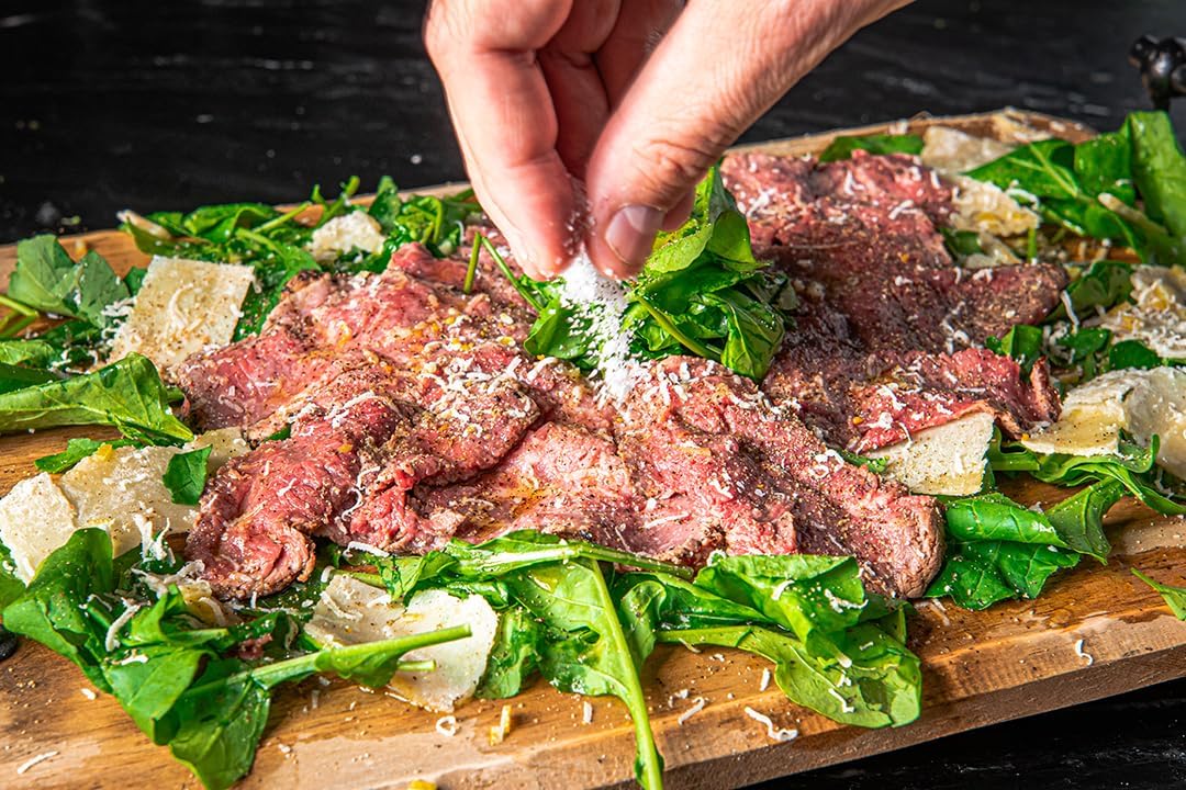 Diamond Crystal salt scattered on cutting board showing easy pinch seasoning benefit