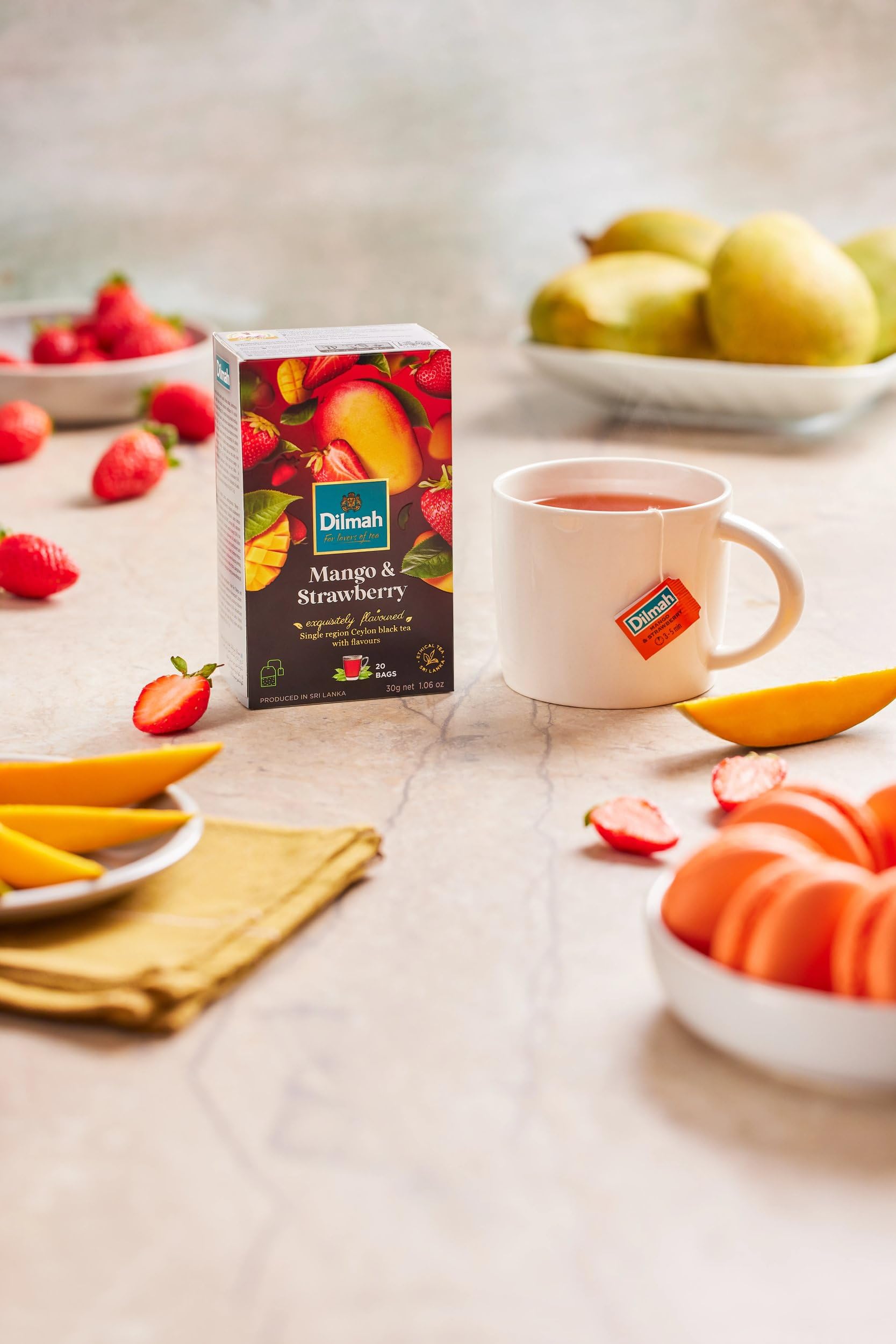 Dilmah box next to a tea bag showing scale and portable 20-bag count