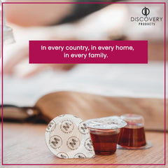 DISCOVERY PRODUCTS cup with visible grape juice content illustrating pure Concord flavor