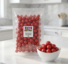 DM Sweets gumballs dispensing from machine illustrating easy refill and flow