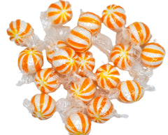 DM Sweets mango candies in clear bowl at party offering colorful decoration and easy serving