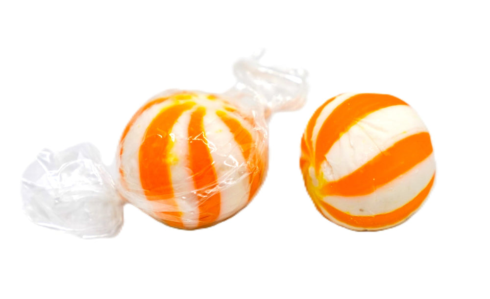 DM Sweets 2 lb bag beside a scale to show bulk size and portion value for buyers