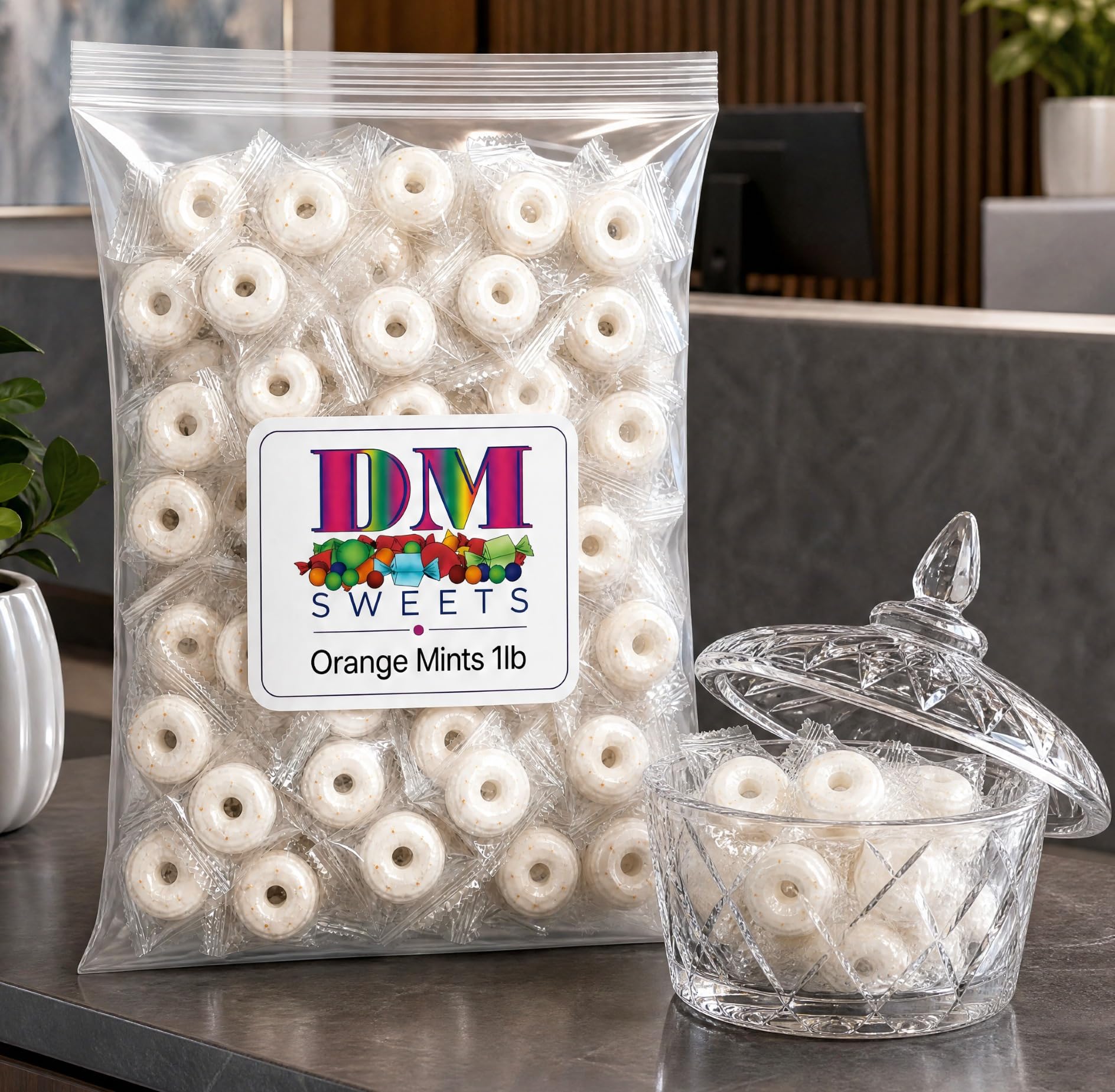 DM Sweets individually wrapped orange mint close-up, hygienic single-serve convenience benefit
