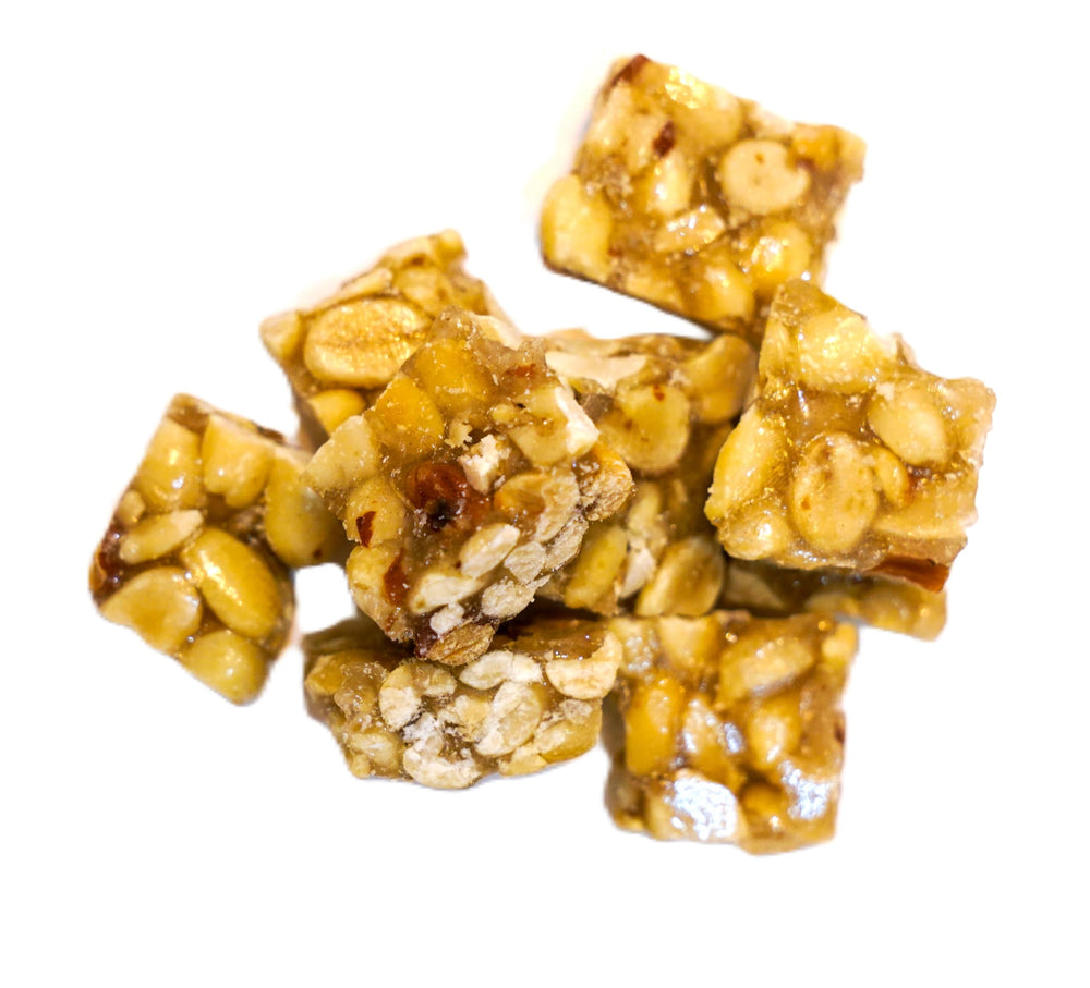 DM Sweets hand holding a square to show size and portion convenience