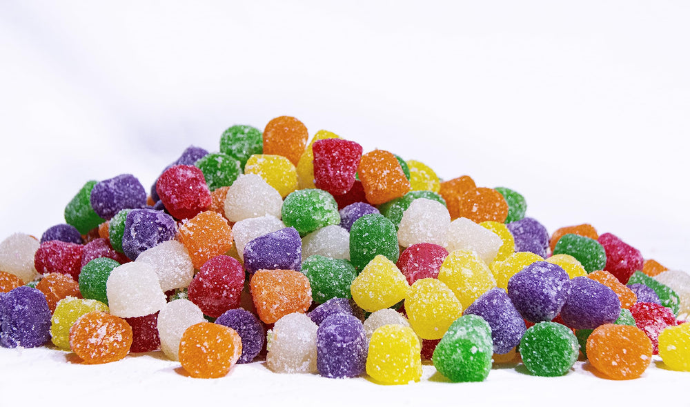 DM Sweets handful in palm illustrating chewiness and portion size