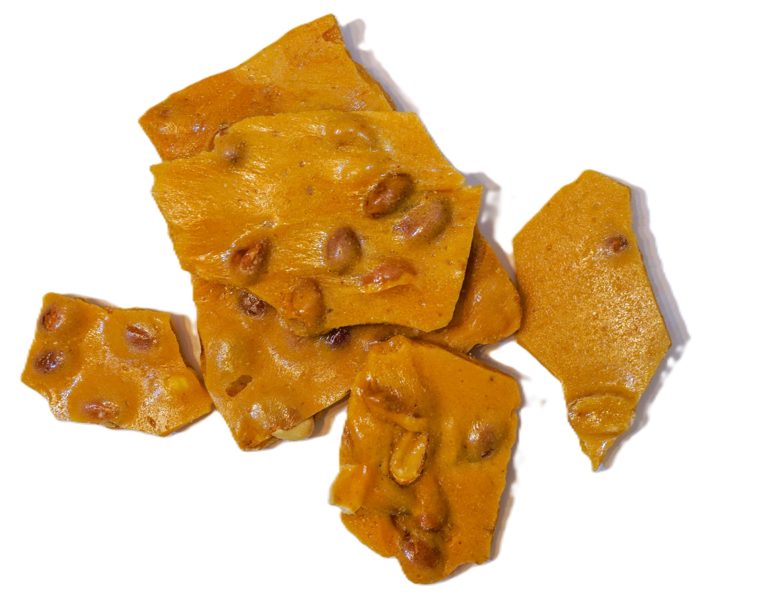 DM Sweets hand breaking brittle piece to show clean snap and easy portioning