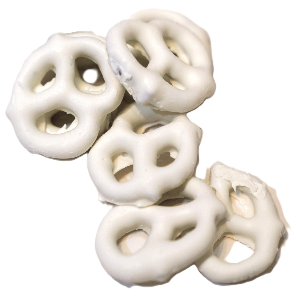 Hand holding DM Sweets pretzel to show size and bite-sized portion convenience