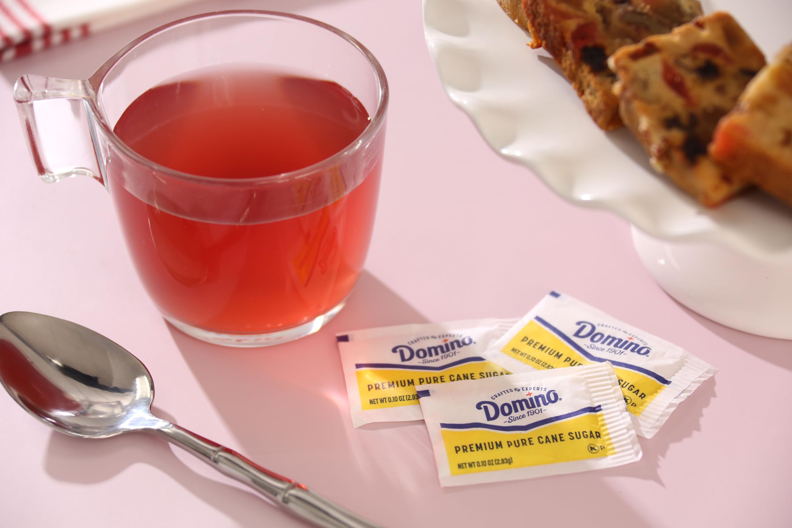 Domino packets on a cafe table next to cups showing professional presentation benefit