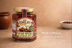 Don Emilio oil with suspended chili flakes in jar, highlights smoky umami appeal