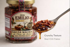 Don Emilio spoon scooping chili crisp with visible flakes, demonstrates serving suggestion