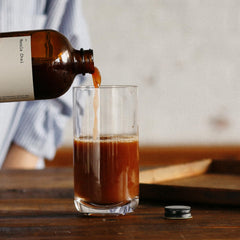 Dona Chai bottle label detail highlighting small-batch and ingredient transparency