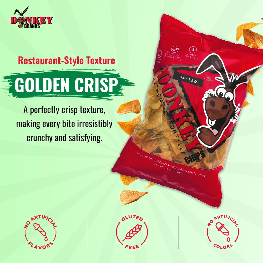 Donkey Authentic Tortilla Chips held in hand to show size and sturdy bite
