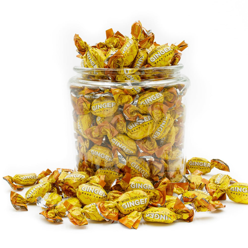 Donty-Tonty candy next to hand for scale, large bulk quantity shown