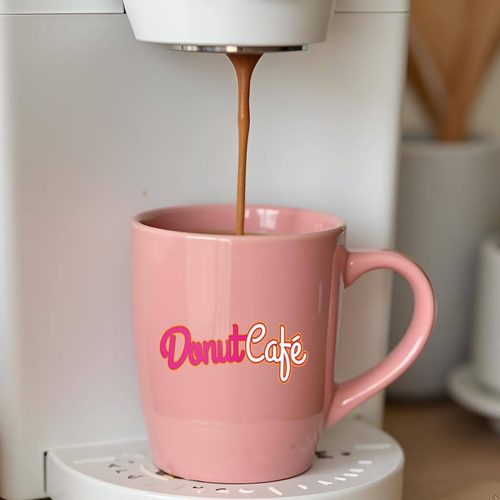 Donut Café pod beside a coin for scale demonstrating compact single-serve size