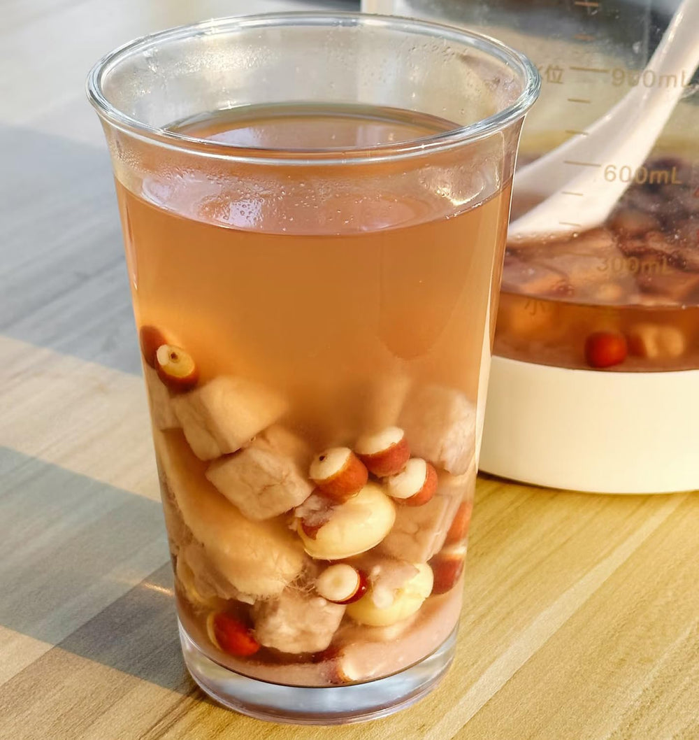 Doorpetal rice congee topped with lotus seeds, demonstrating added texture