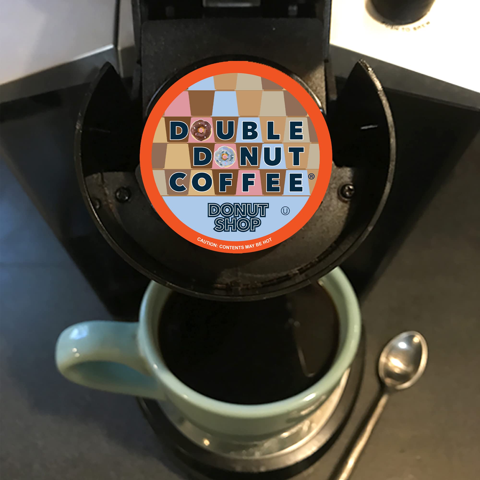 Double Donut dark roast grounds close-up showing rich roast flavor benefit