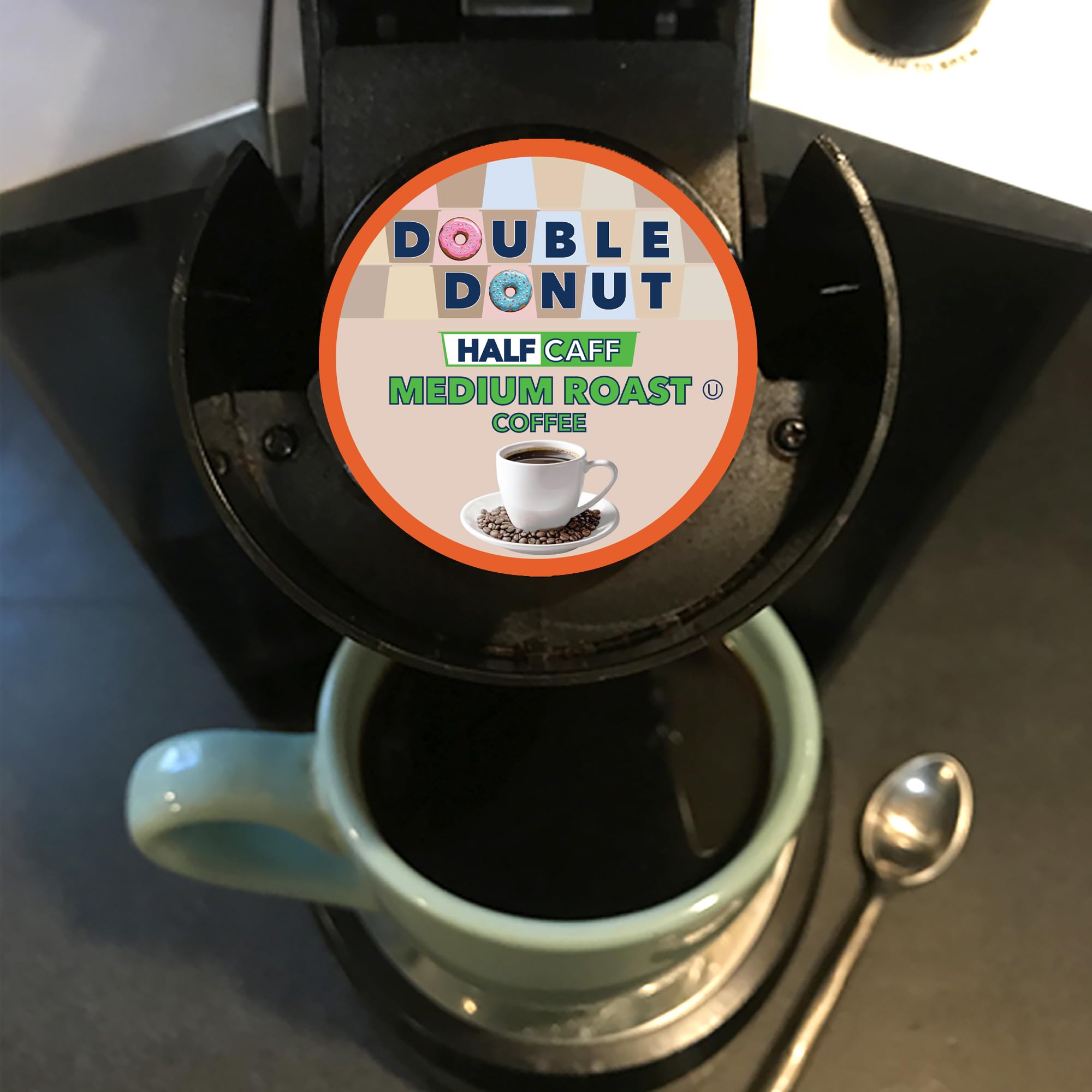 Double Donut recyclable pod held in hand showcasing eco-friendly benefit